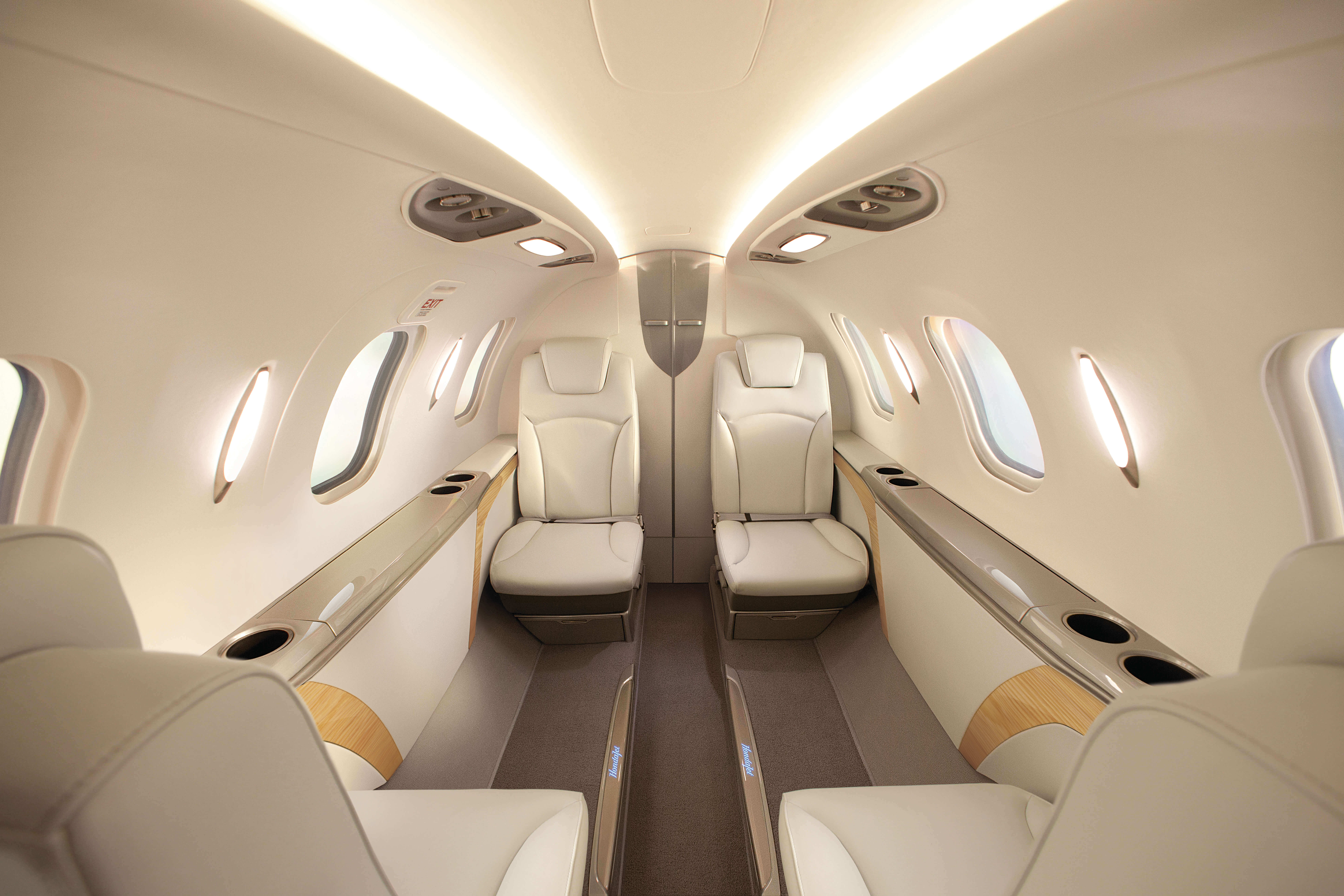 The leather interior seating area of a business jet.