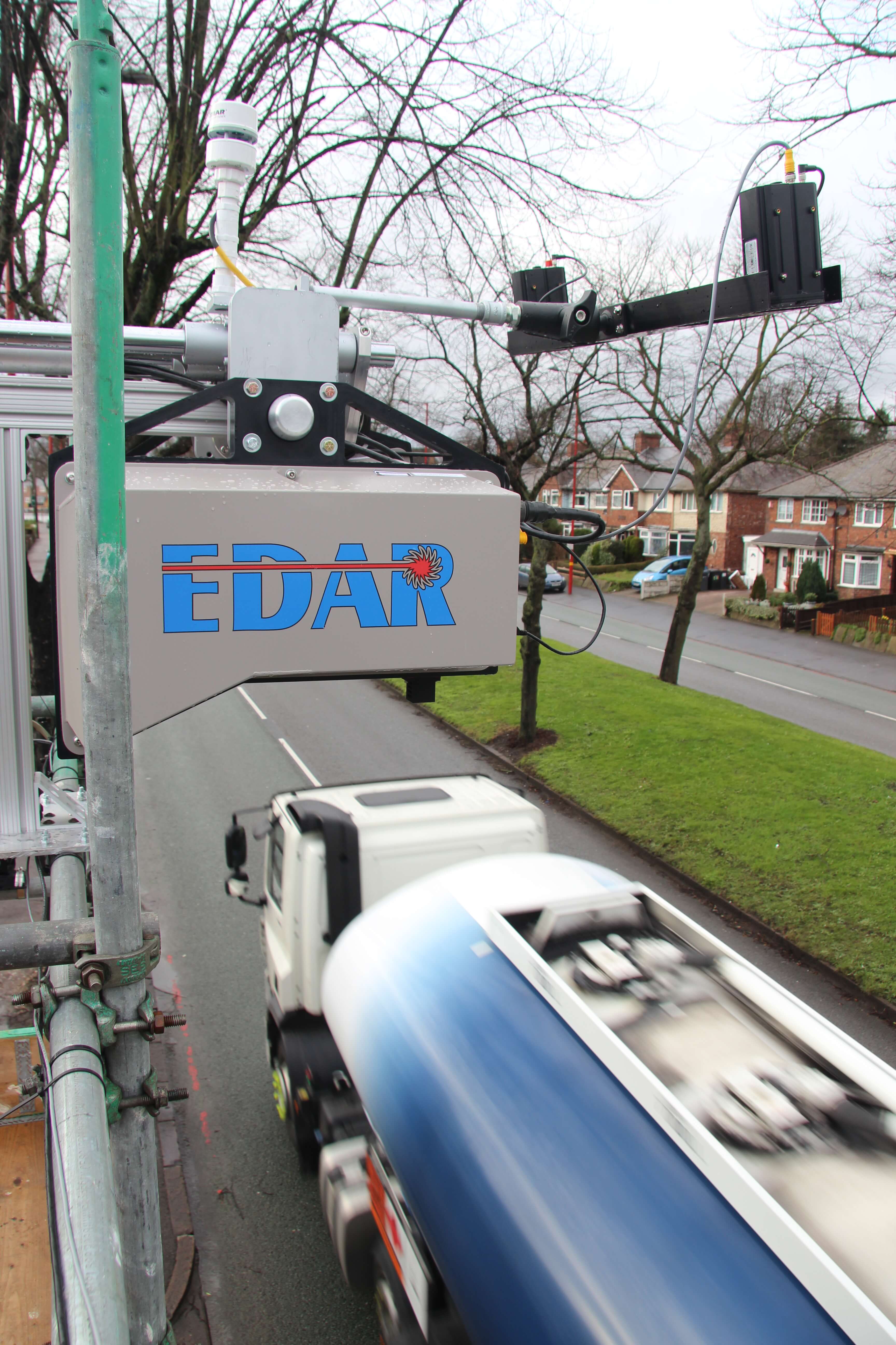 A carbon dioxide detector scanning a passing truck on the road