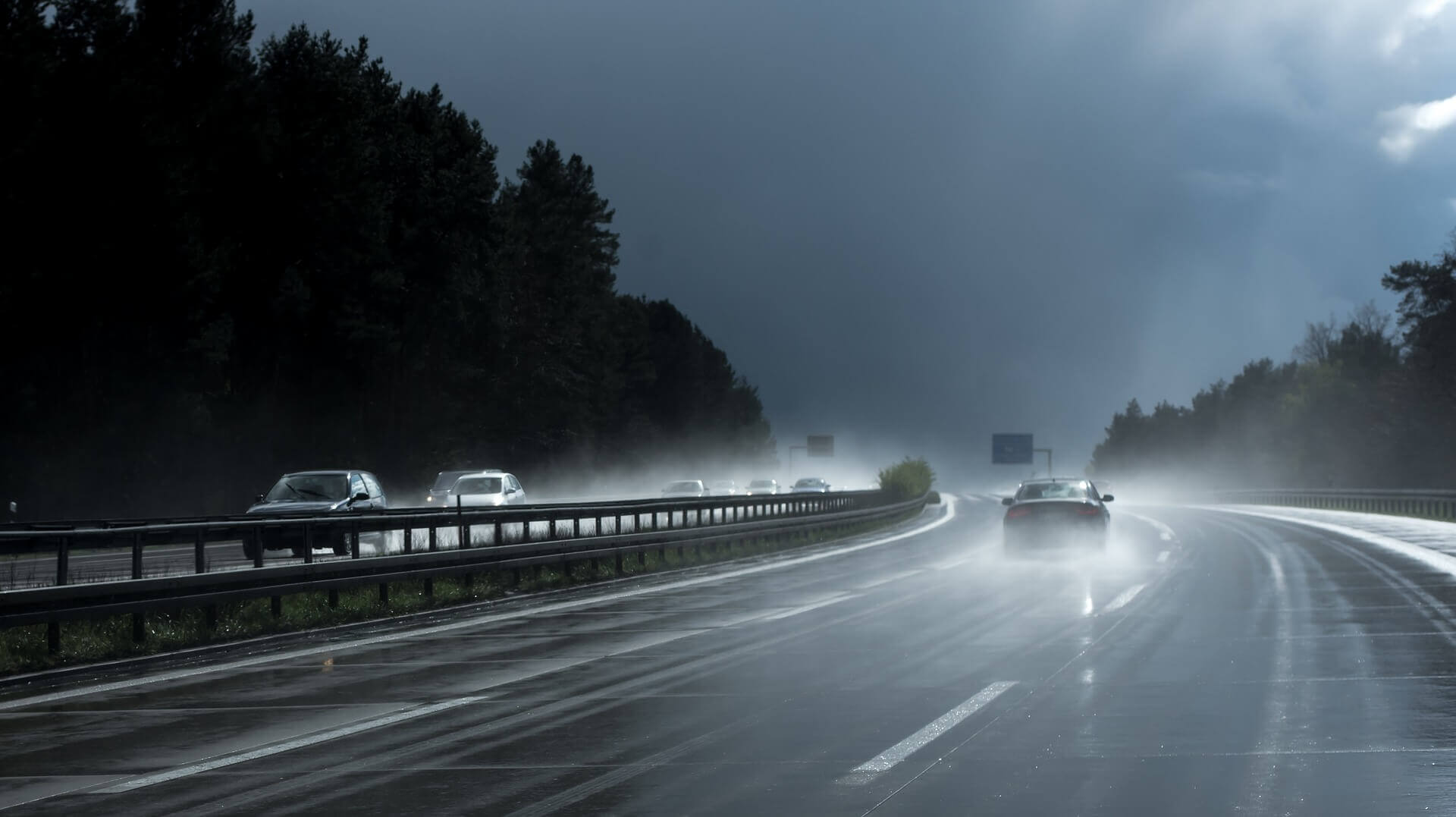 Cars driving on the highway just after rainfall