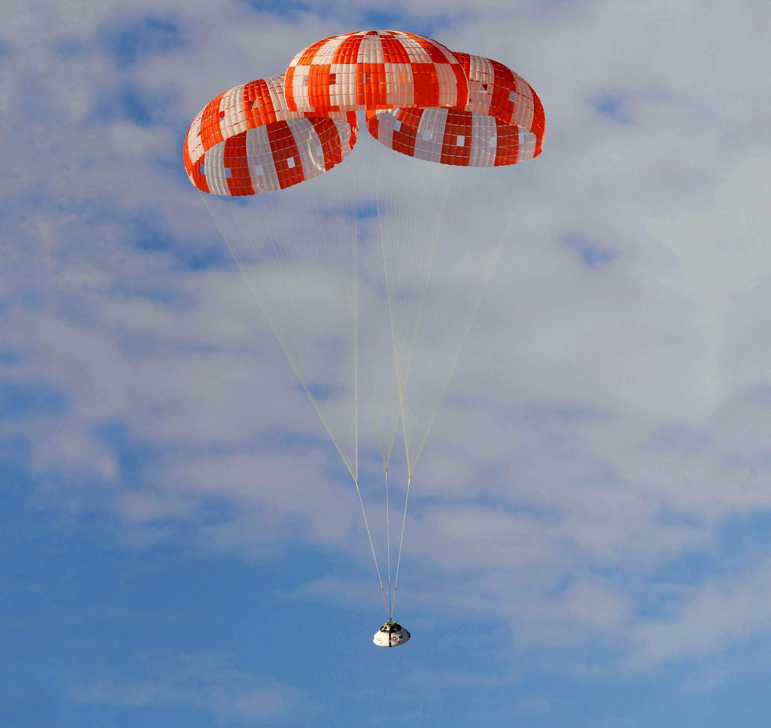 The Orion capsule with parachutes deployed, taken during its first test flight