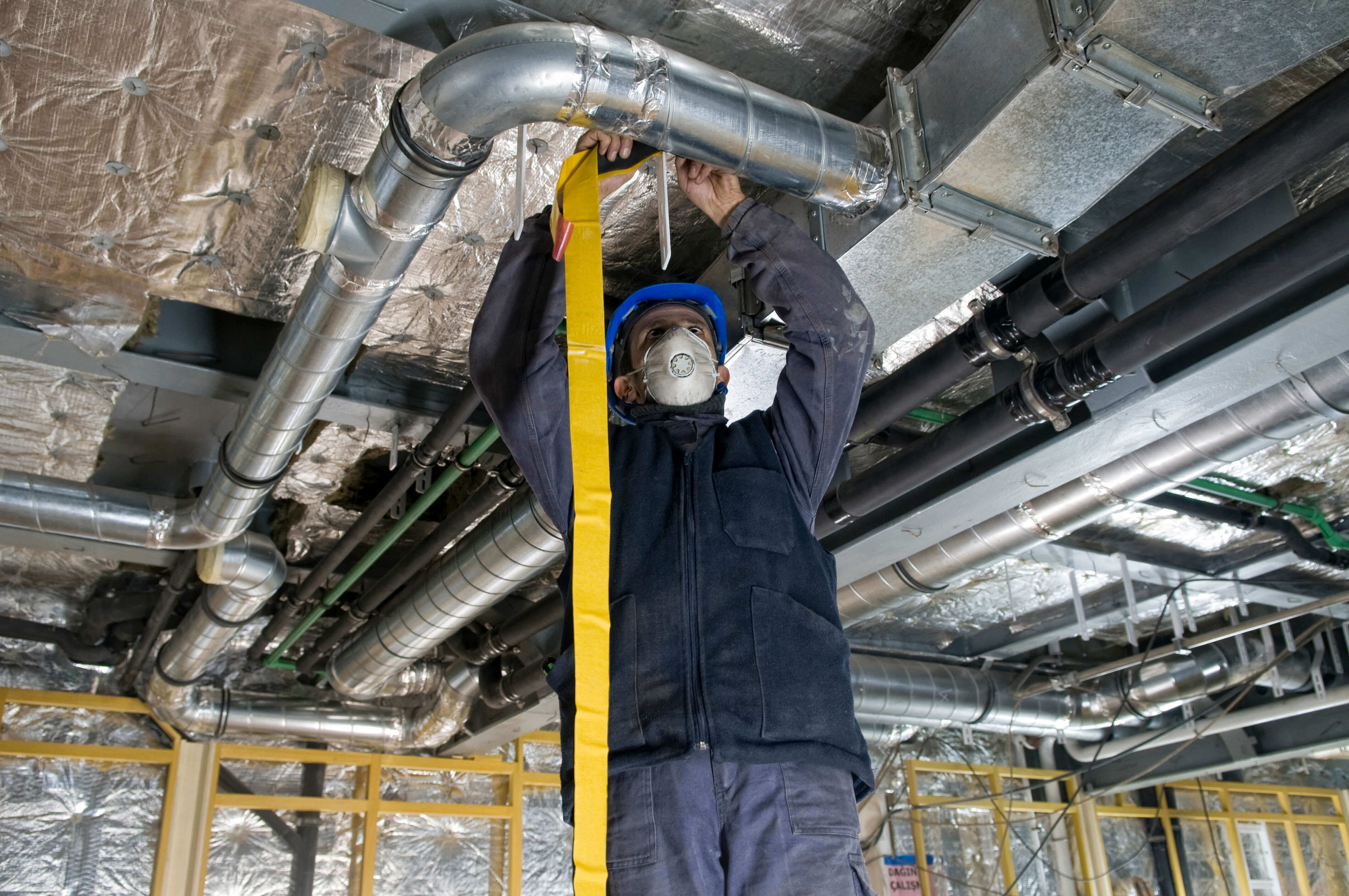 Man working on air ducts
