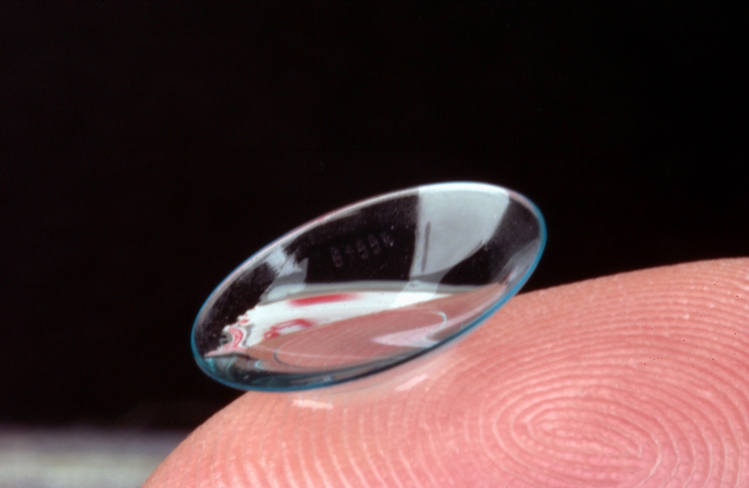 Contact lens on a fingertip 