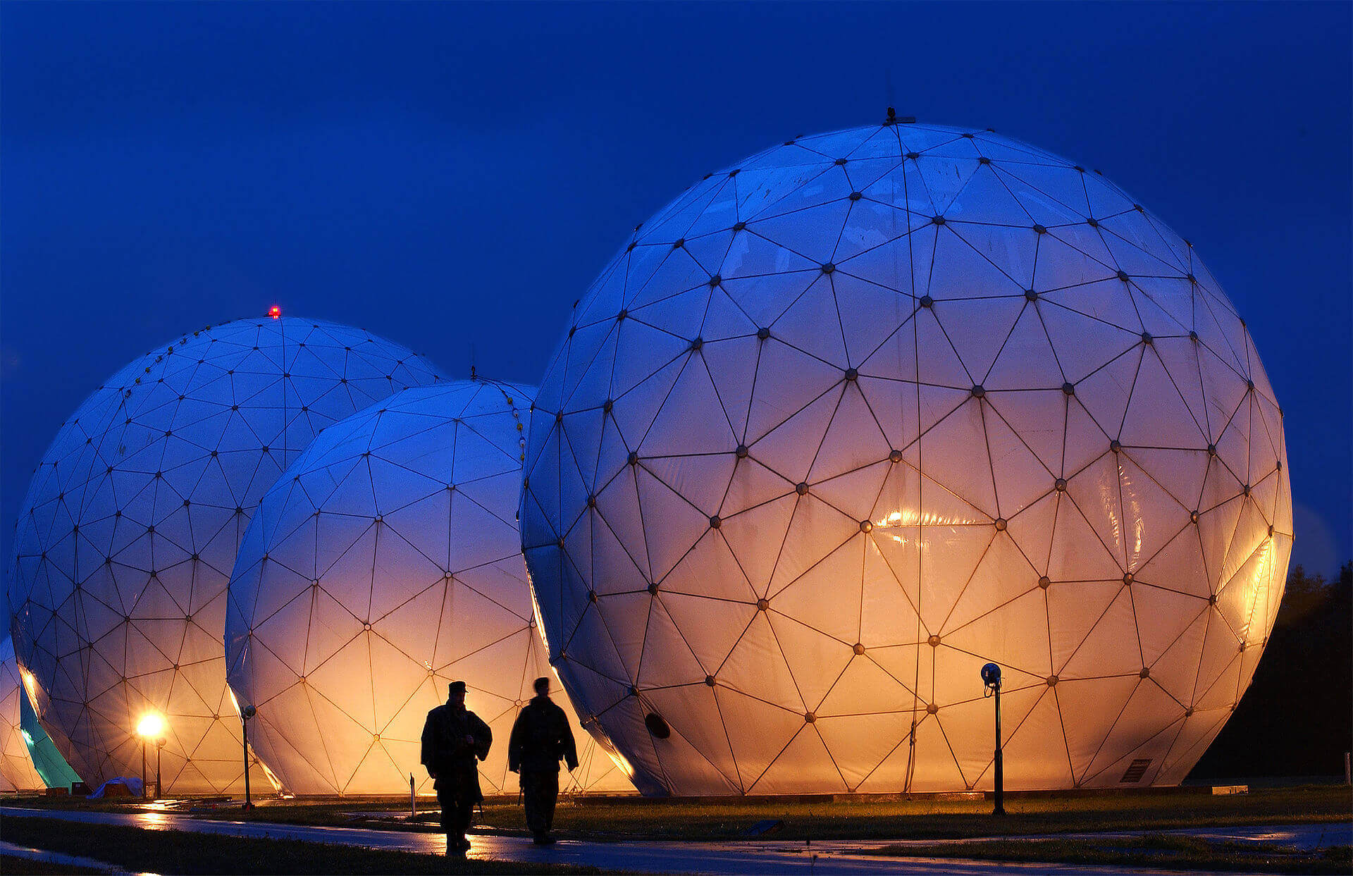 Three radomes at night 