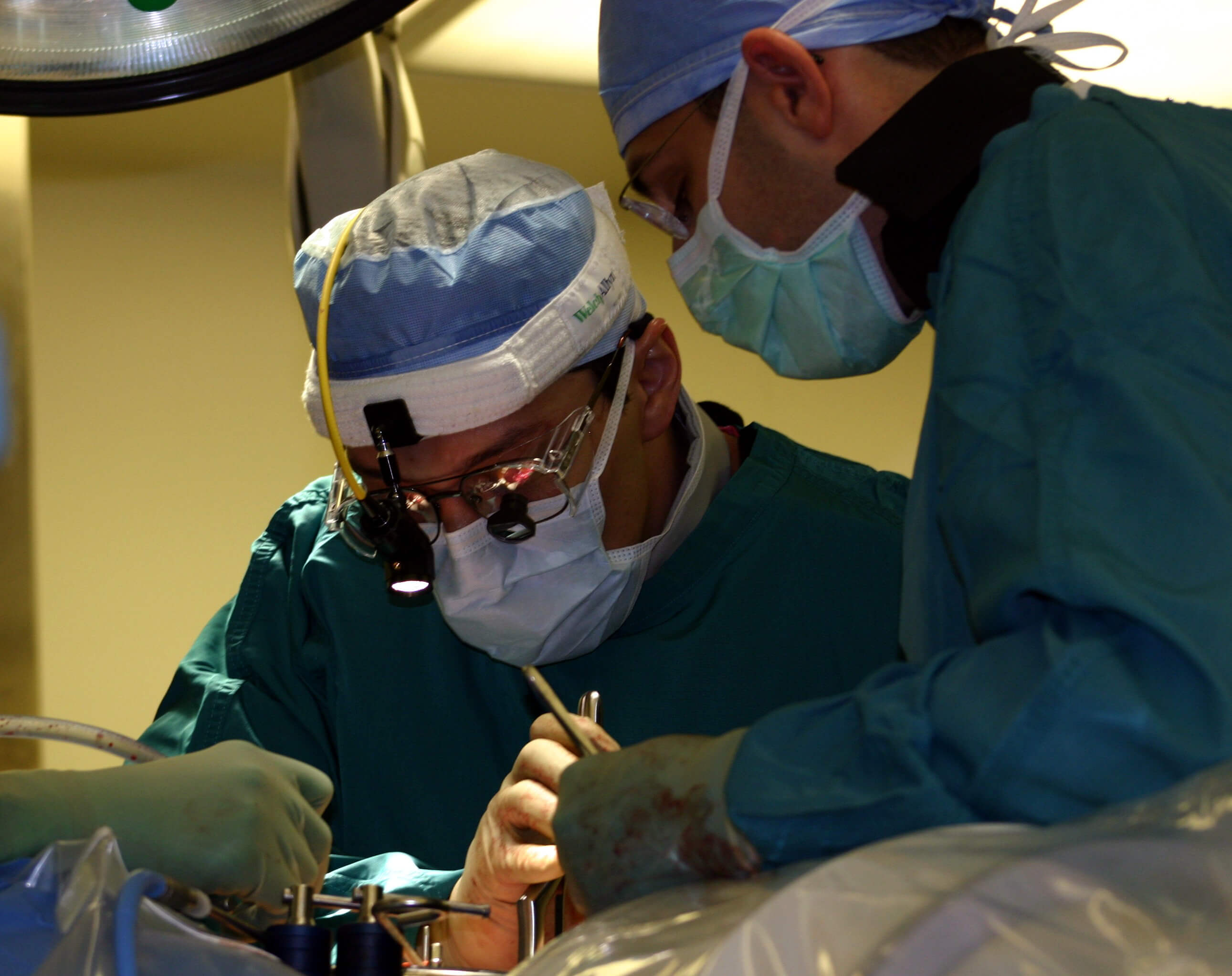 Surgeons operating on a patient
