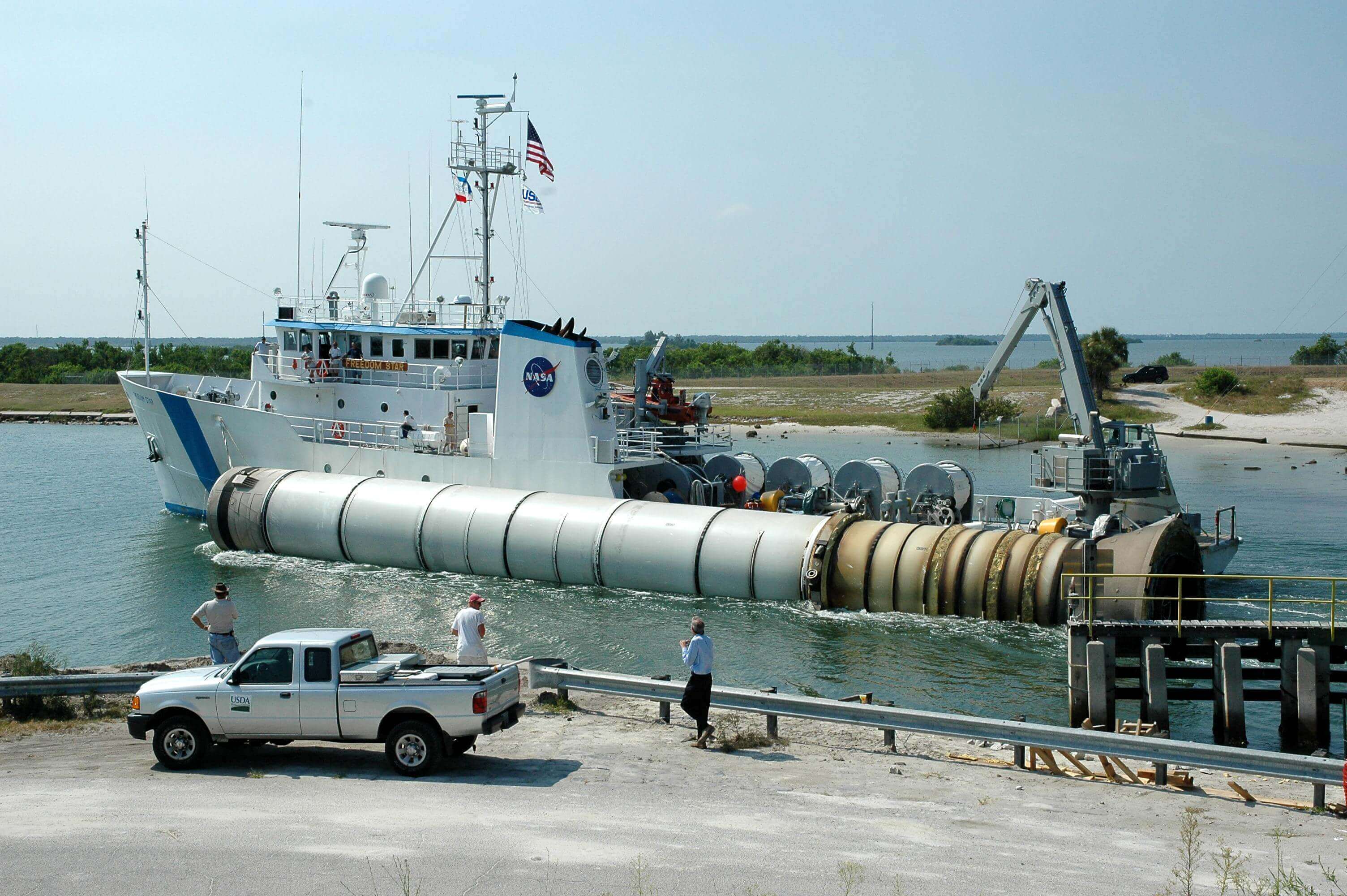 A spent solid rocket booster being retrieved from Port Canaveral 