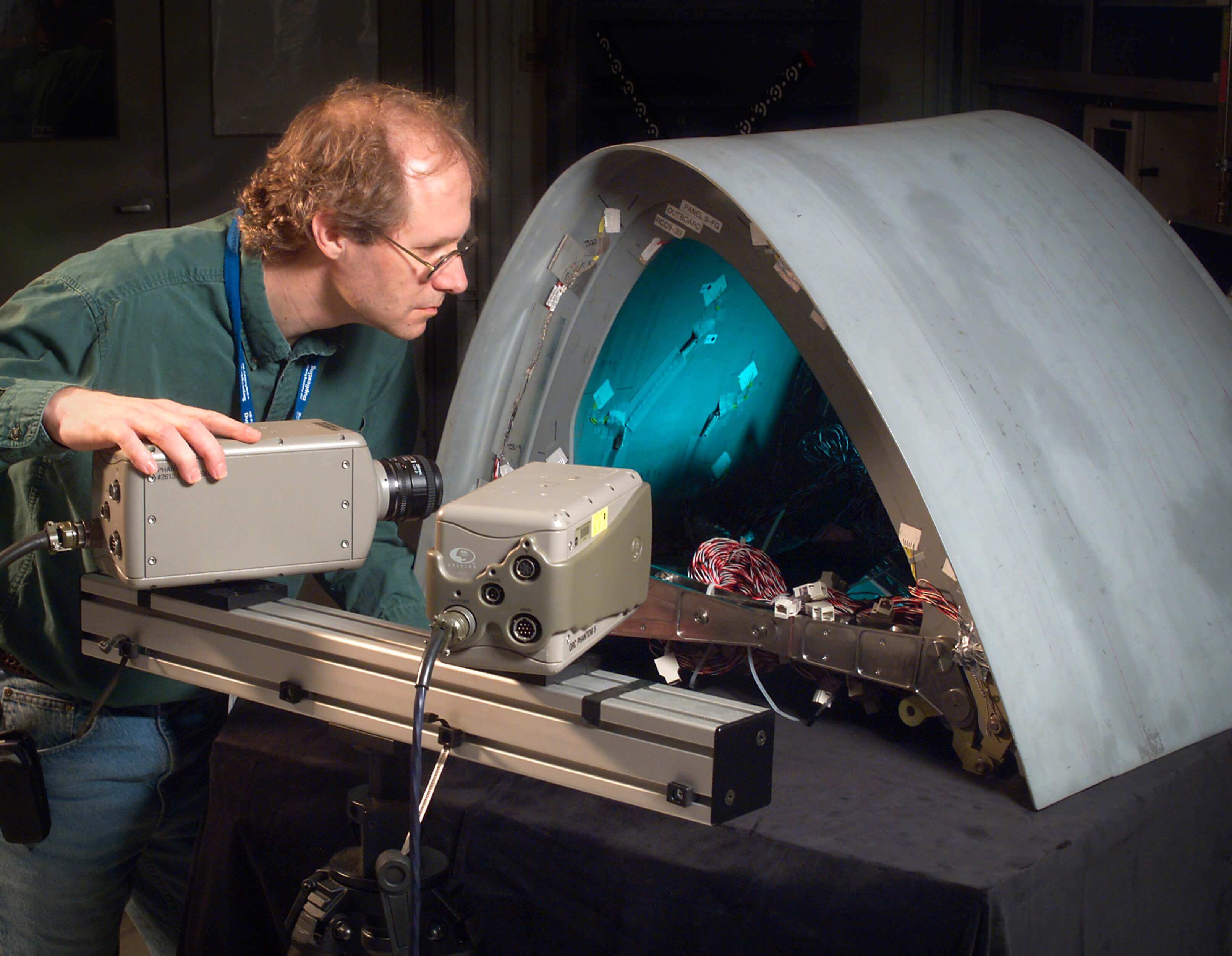 NASA researcher using high-speed cameras to analyze impacts 