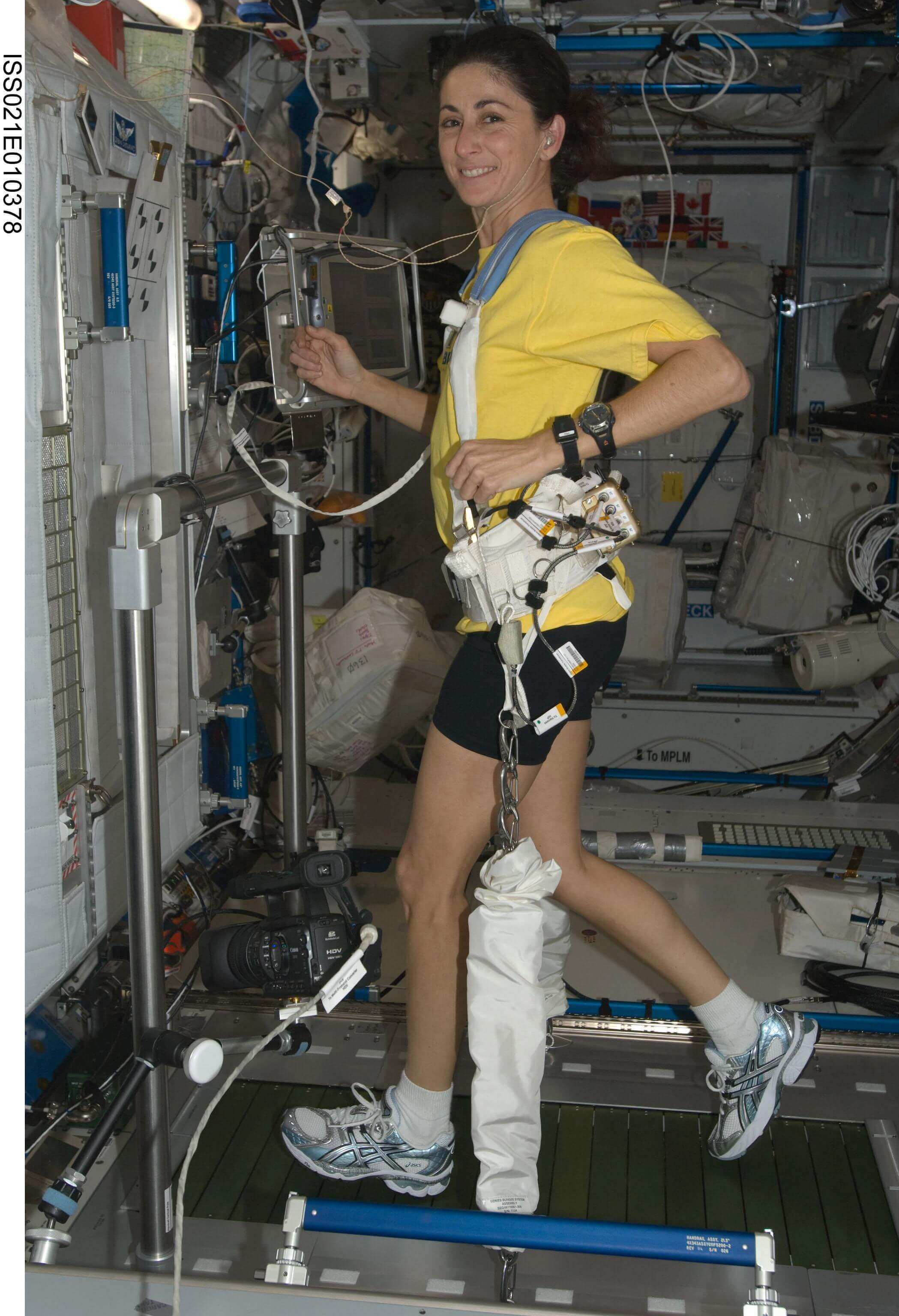 Astronaut using a treadmill on the International Space Station 