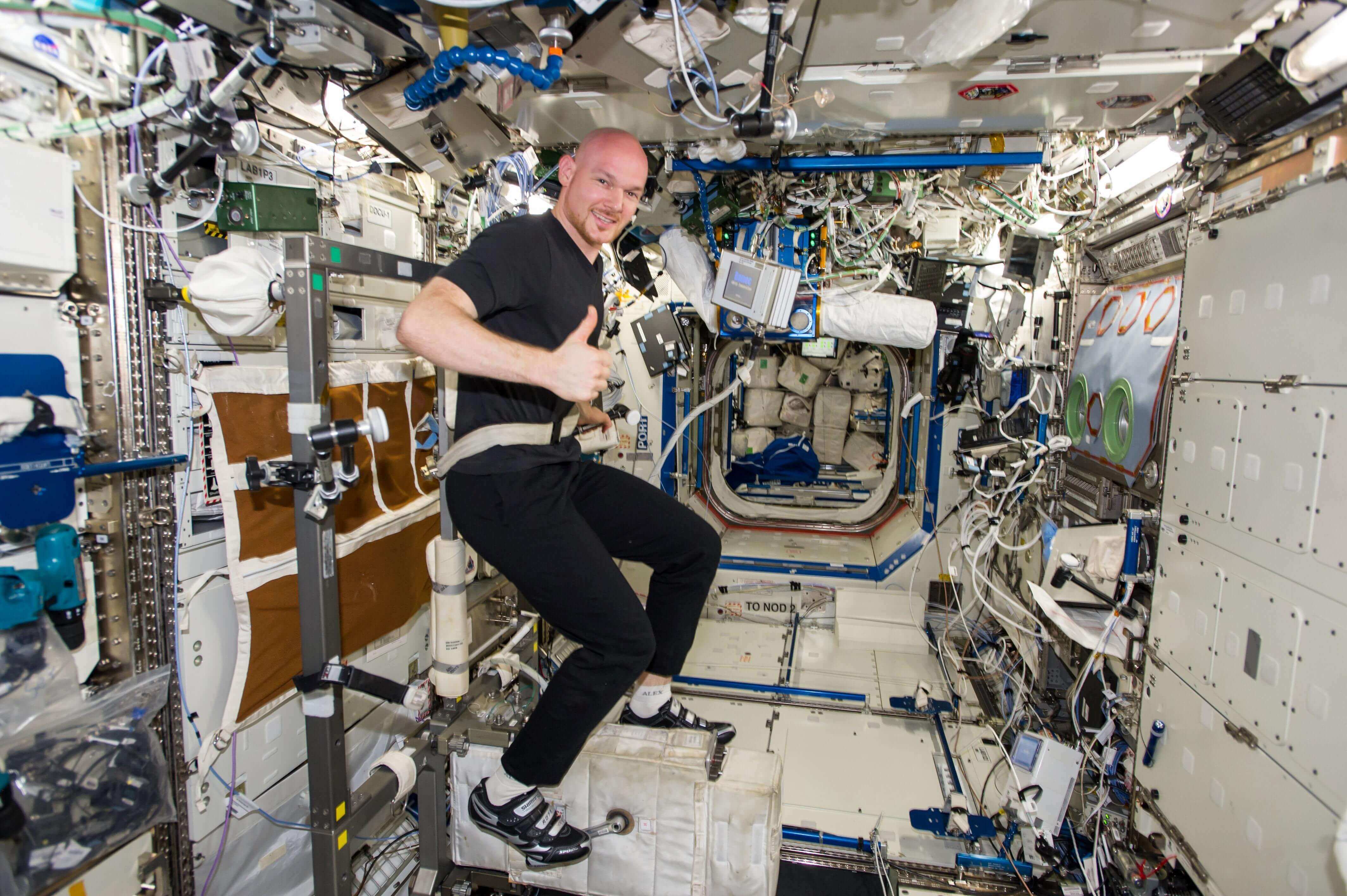 Astronaut using a stationary bike on the International Space Station 