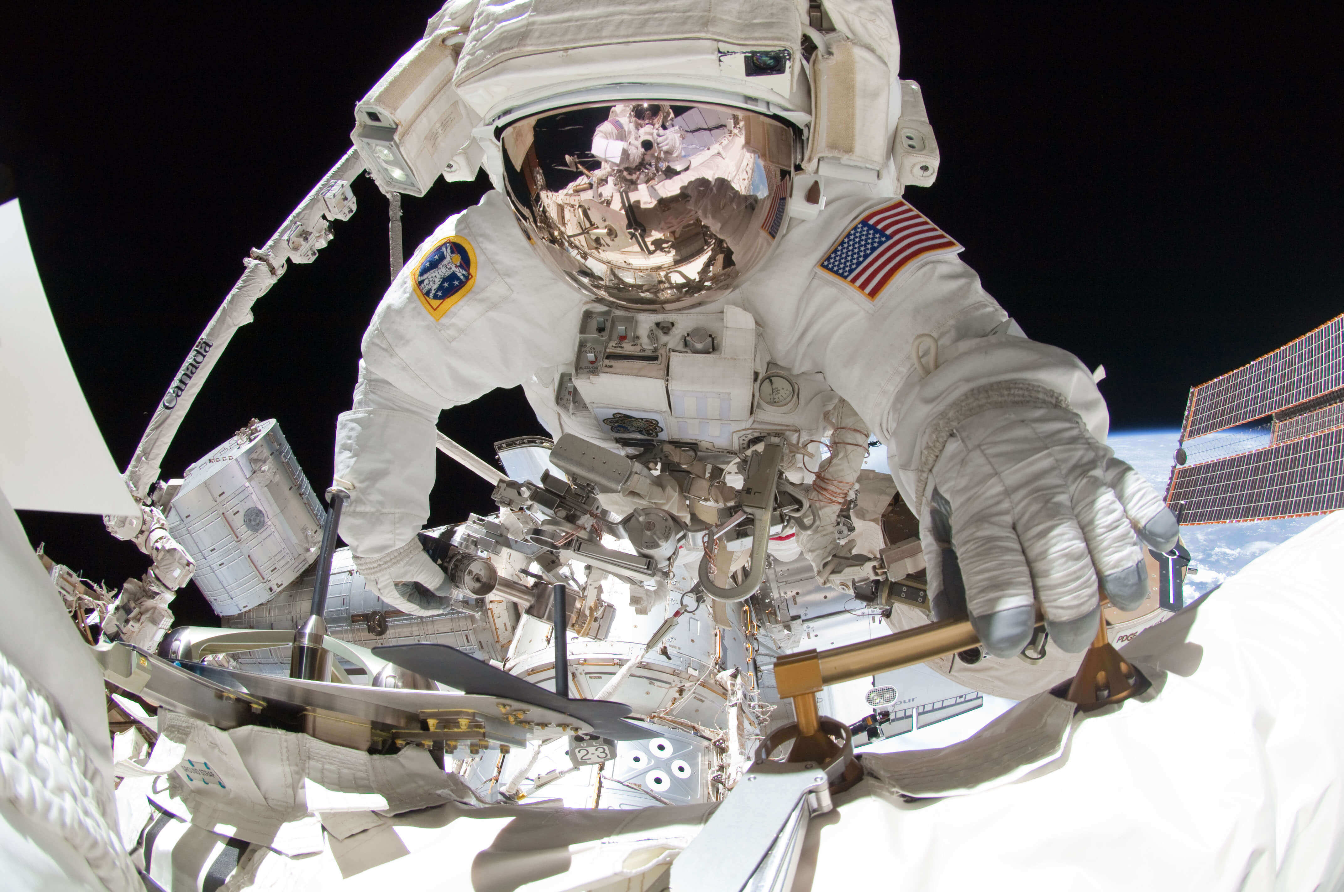 Astronaut on a spacewalk outside the International Space Station 