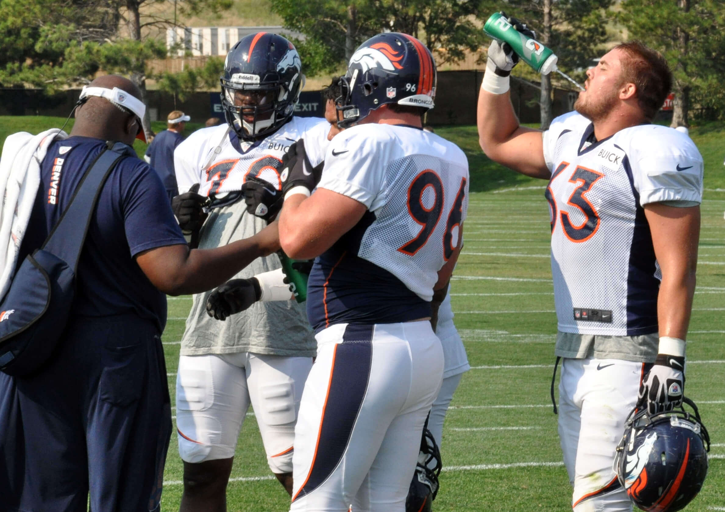 Football players cooling off on the sideline 