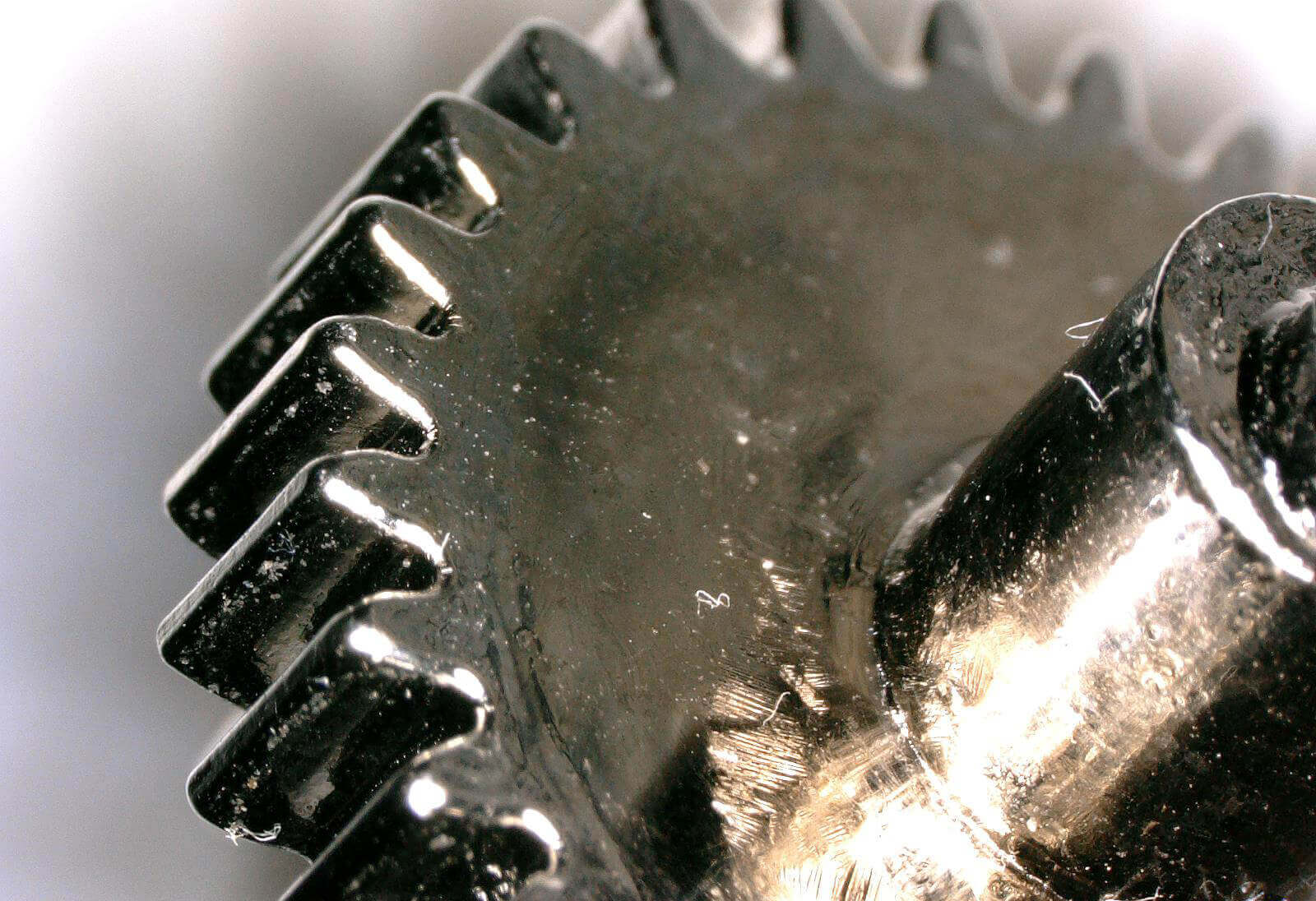 Closeup of a gear made with liquid metal 