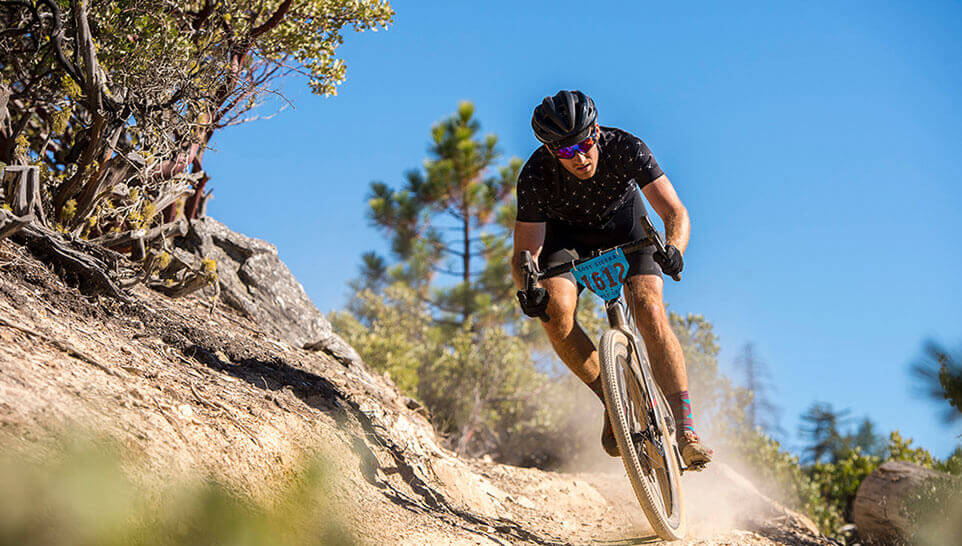 A racer mountain biking 