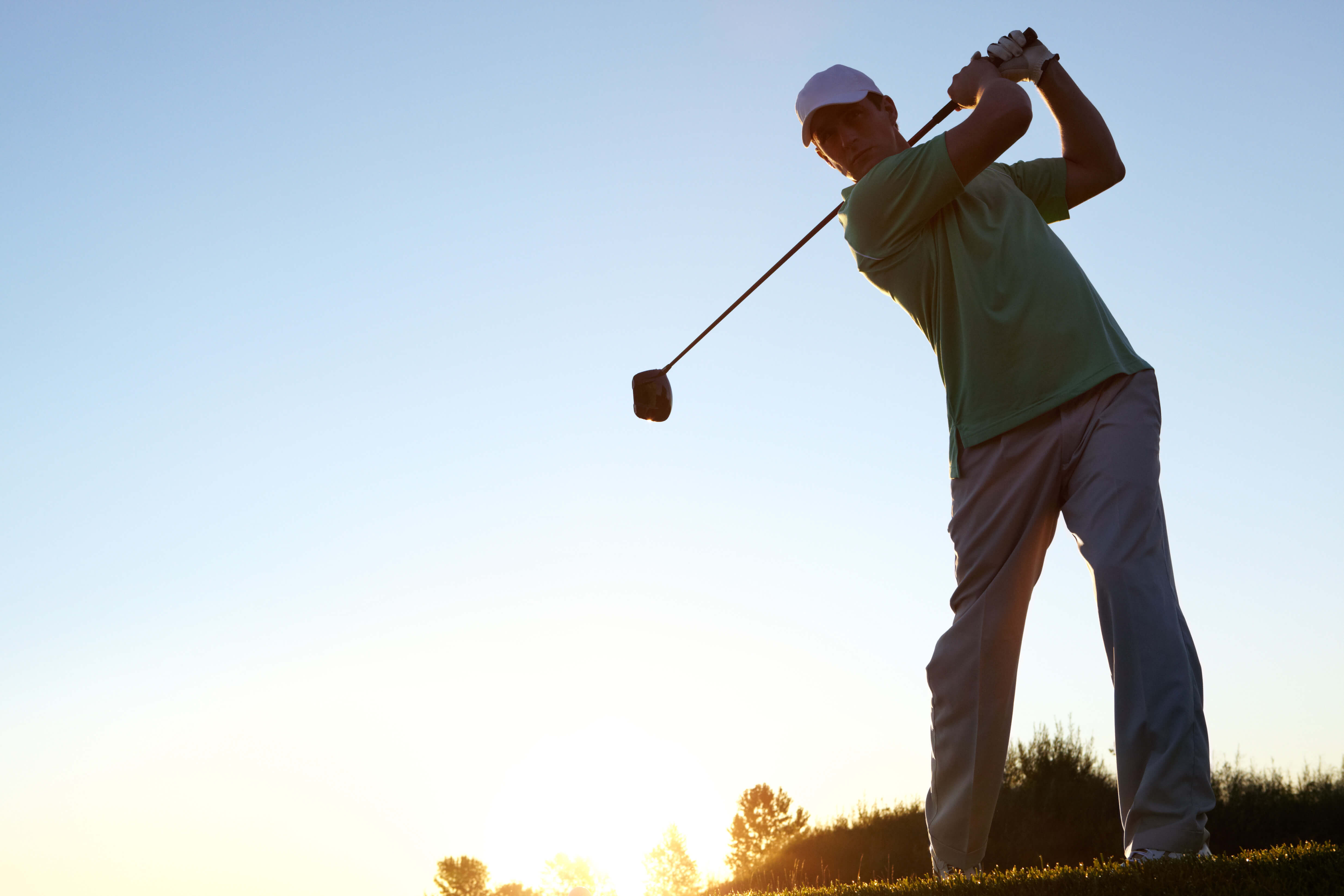 Golfer prepares for a long drive 