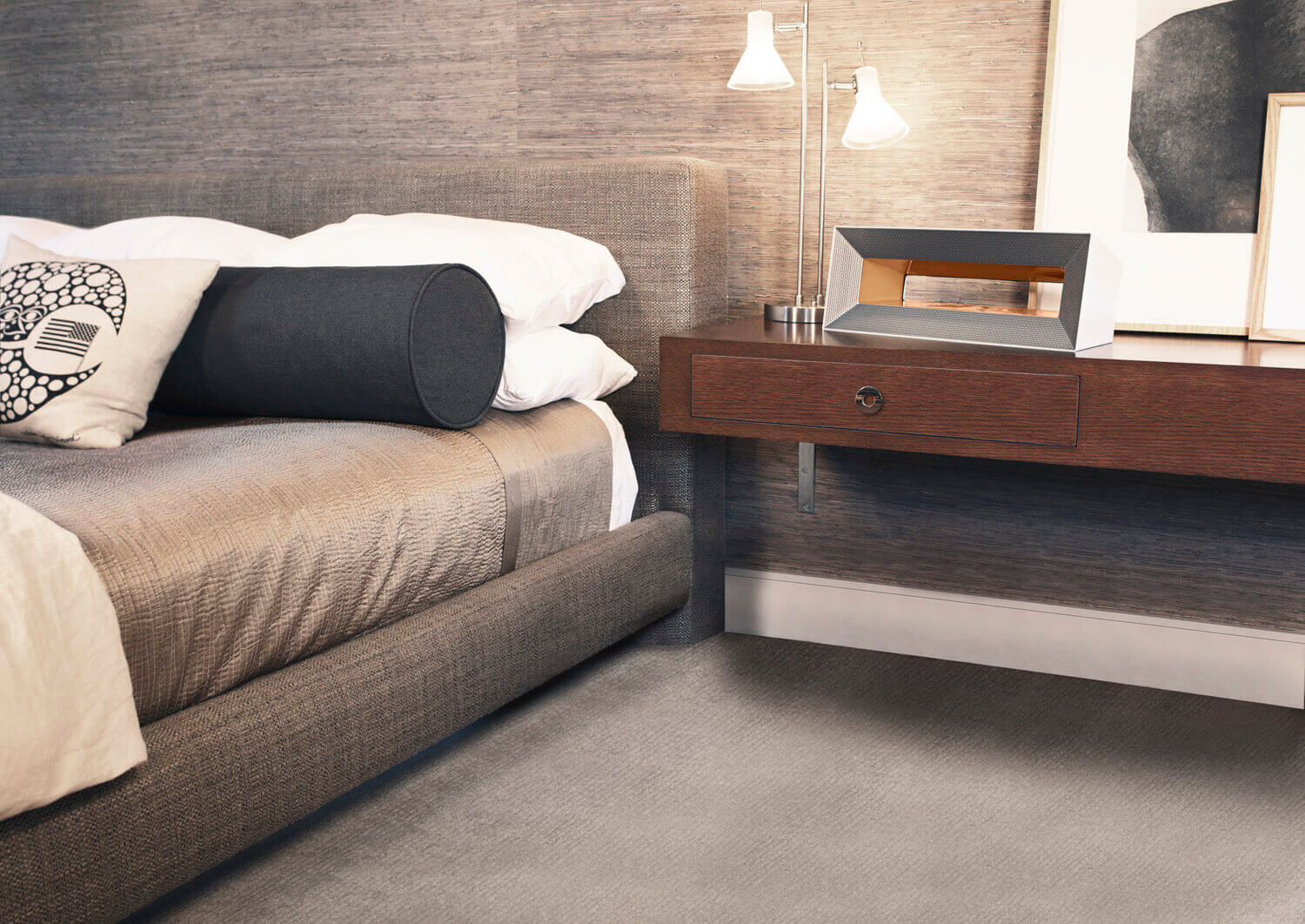Home air purifier sitting on a table next to a bed