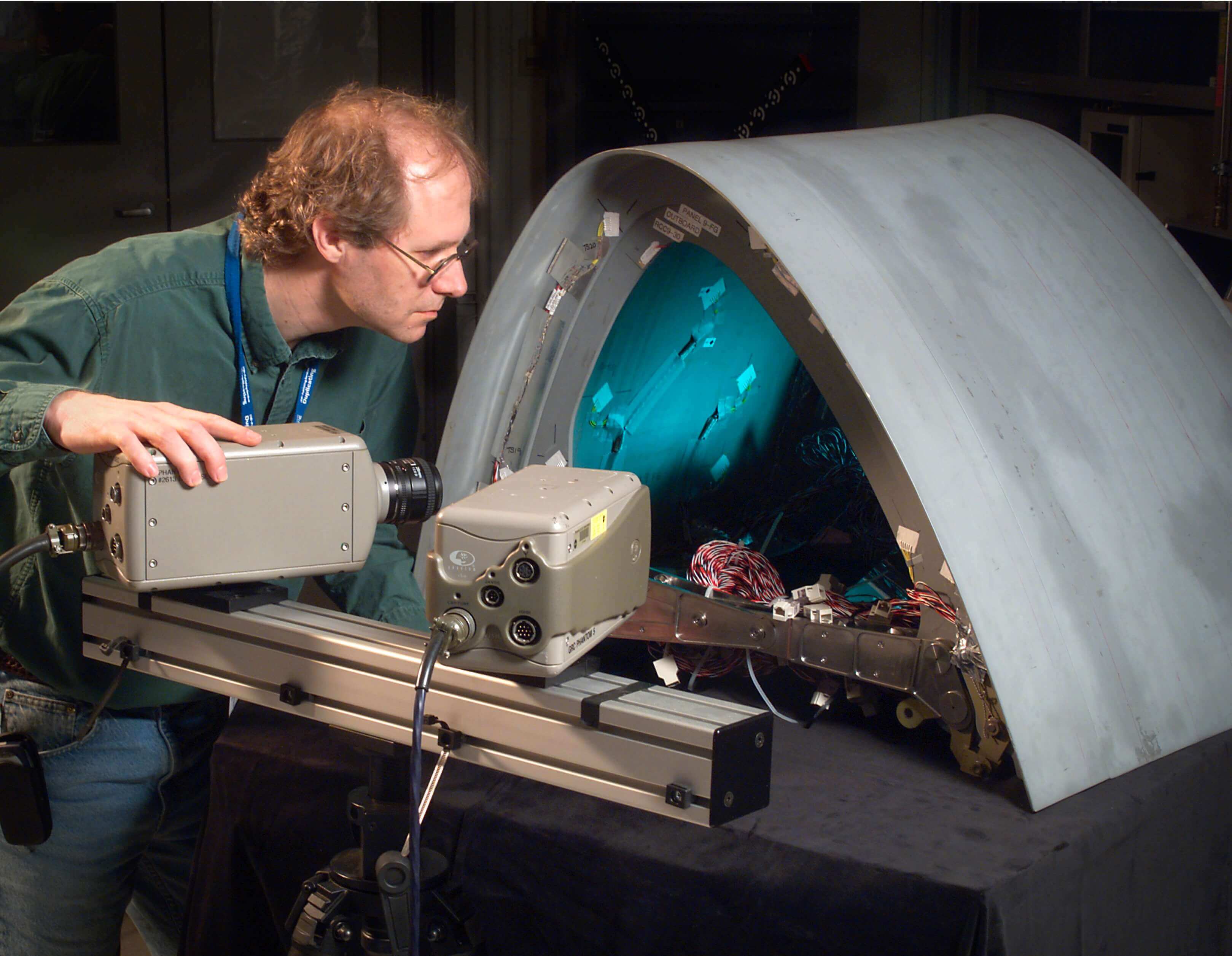 NASA researcher examining materials and assessing their reaction to various impacts