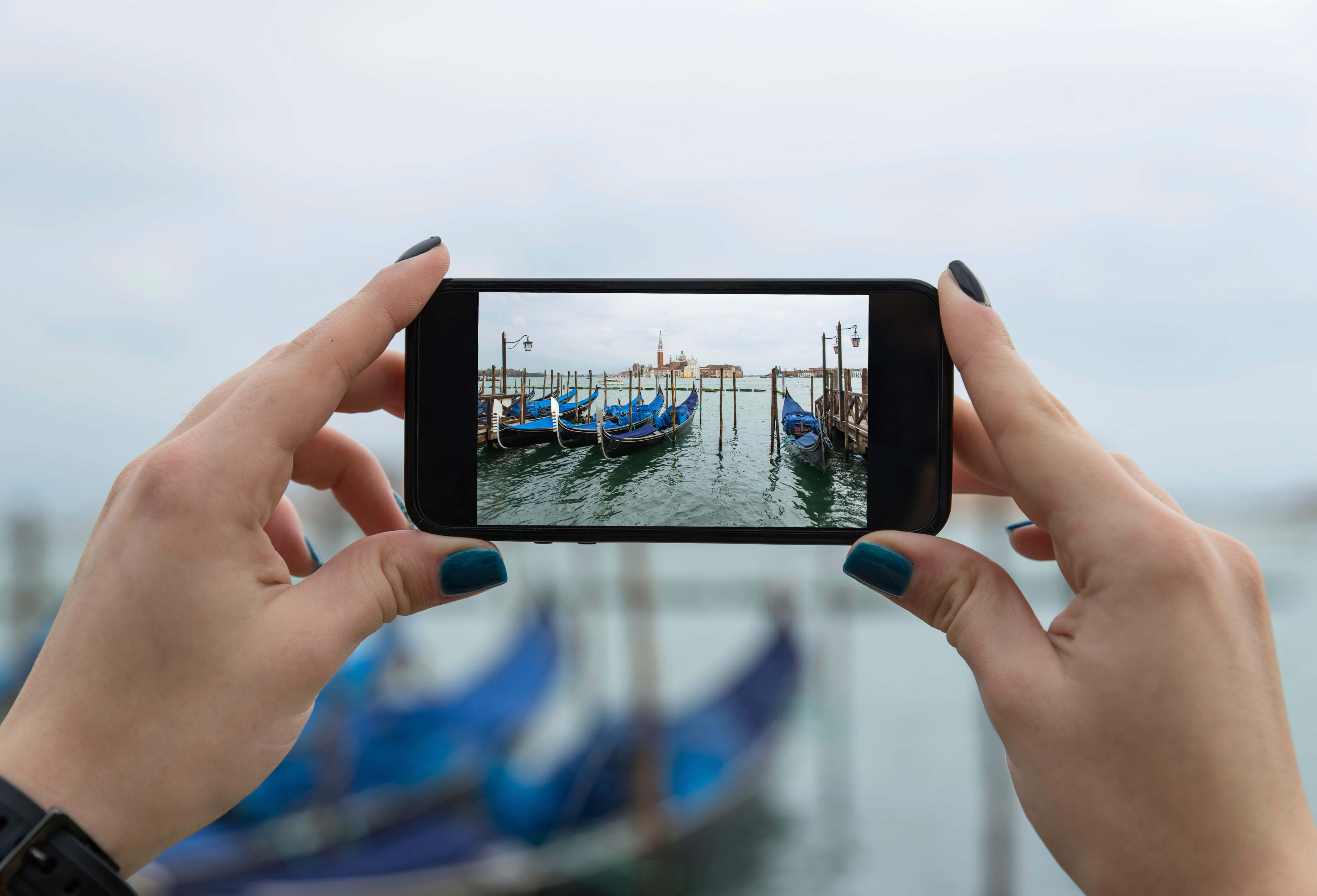 Woman taking a picture with her cell phone