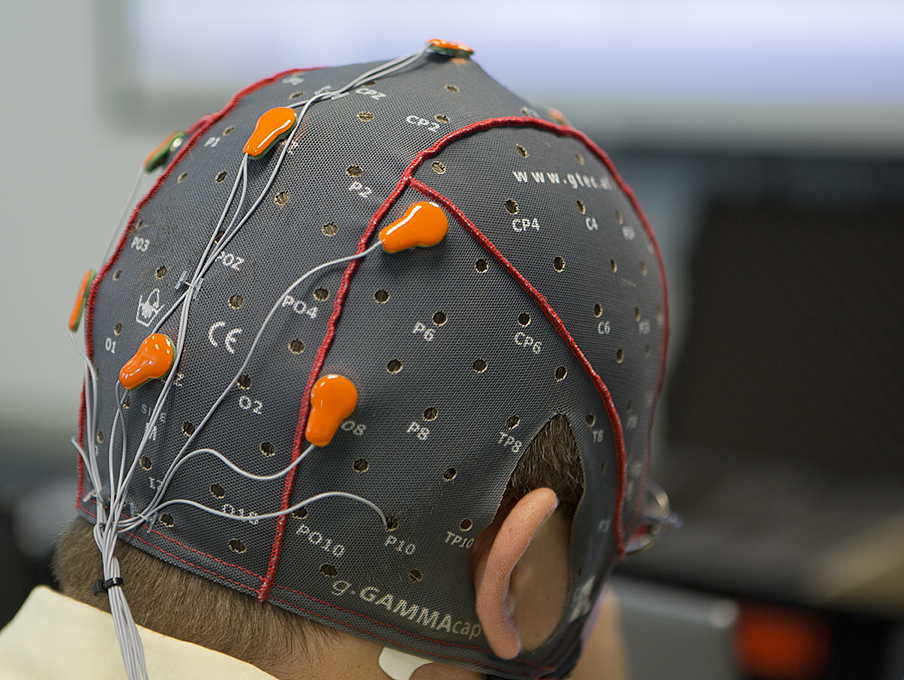 A helmet with sensors measures brainwave activity in pilot stress tests.