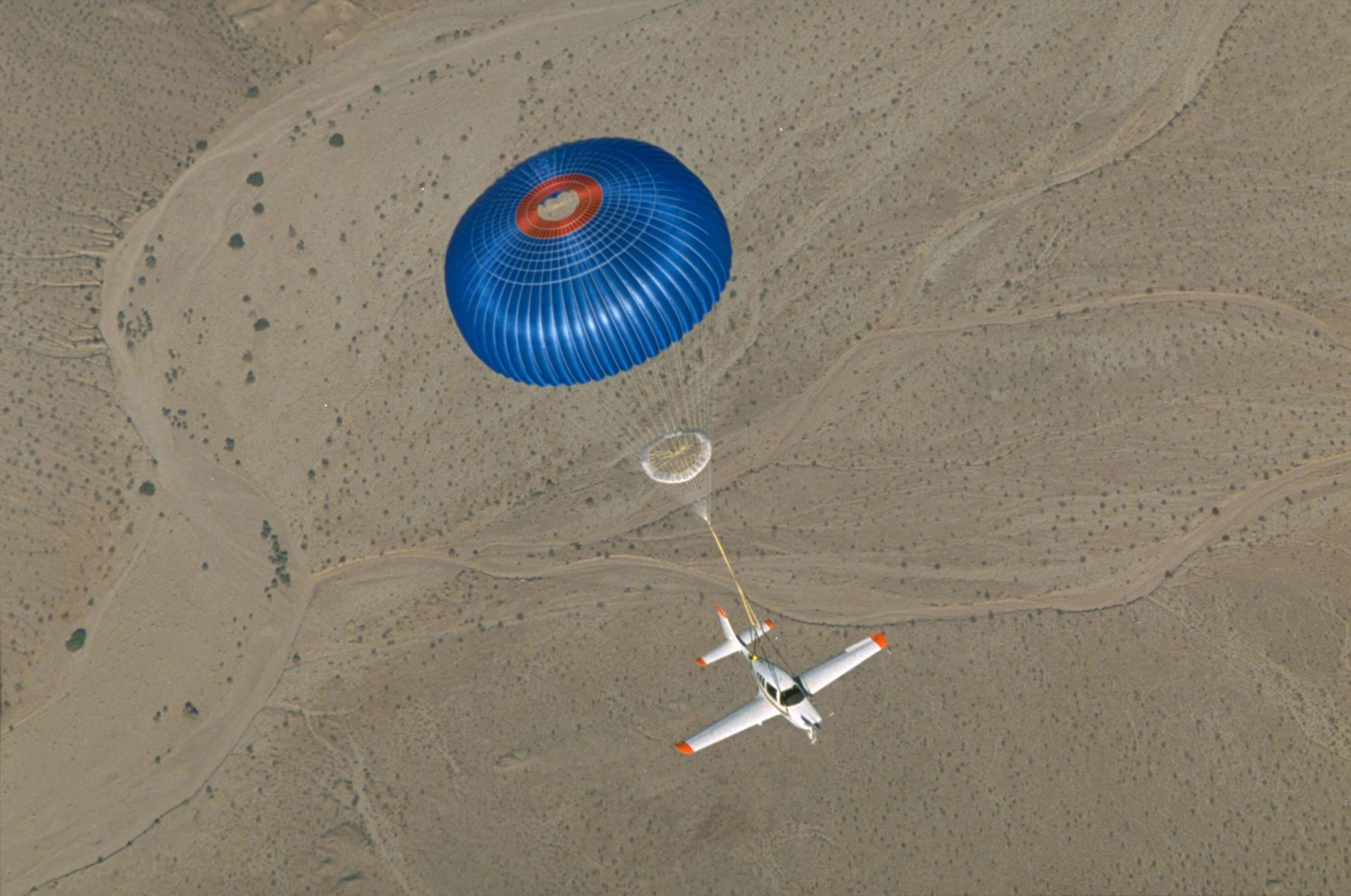 A parachute deployed for an airplane midflight.