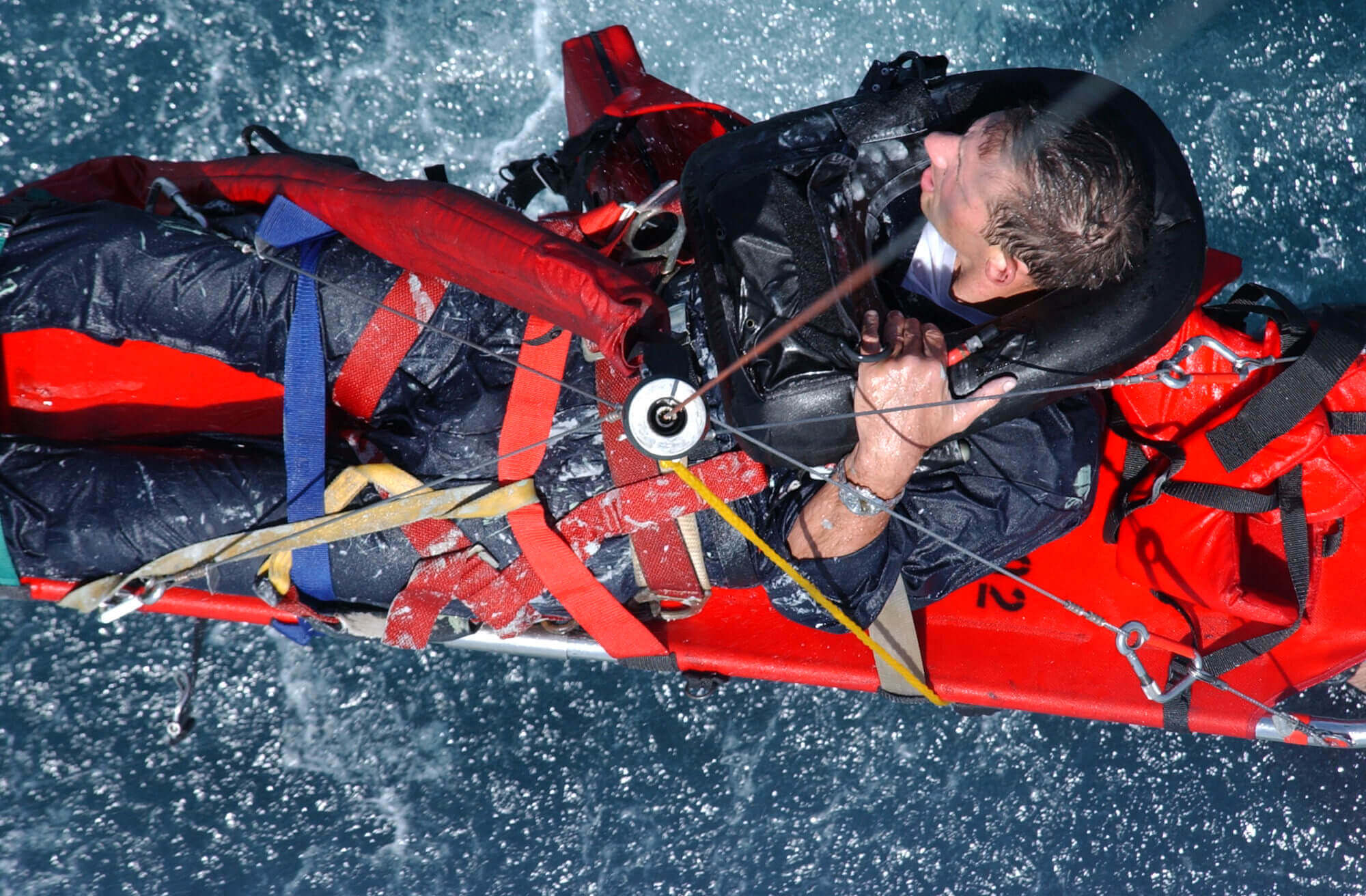 Sailor being rescued at sea following an accident