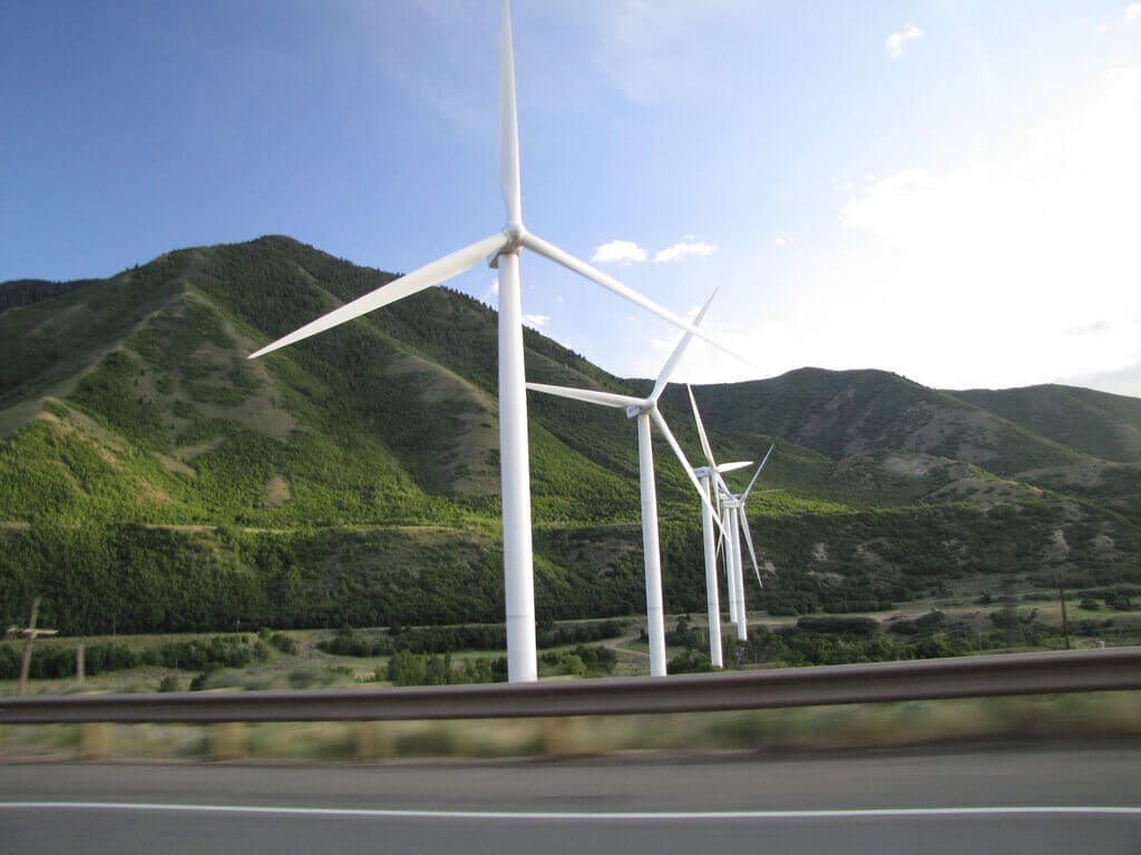 Wind turbines along the side of a road
