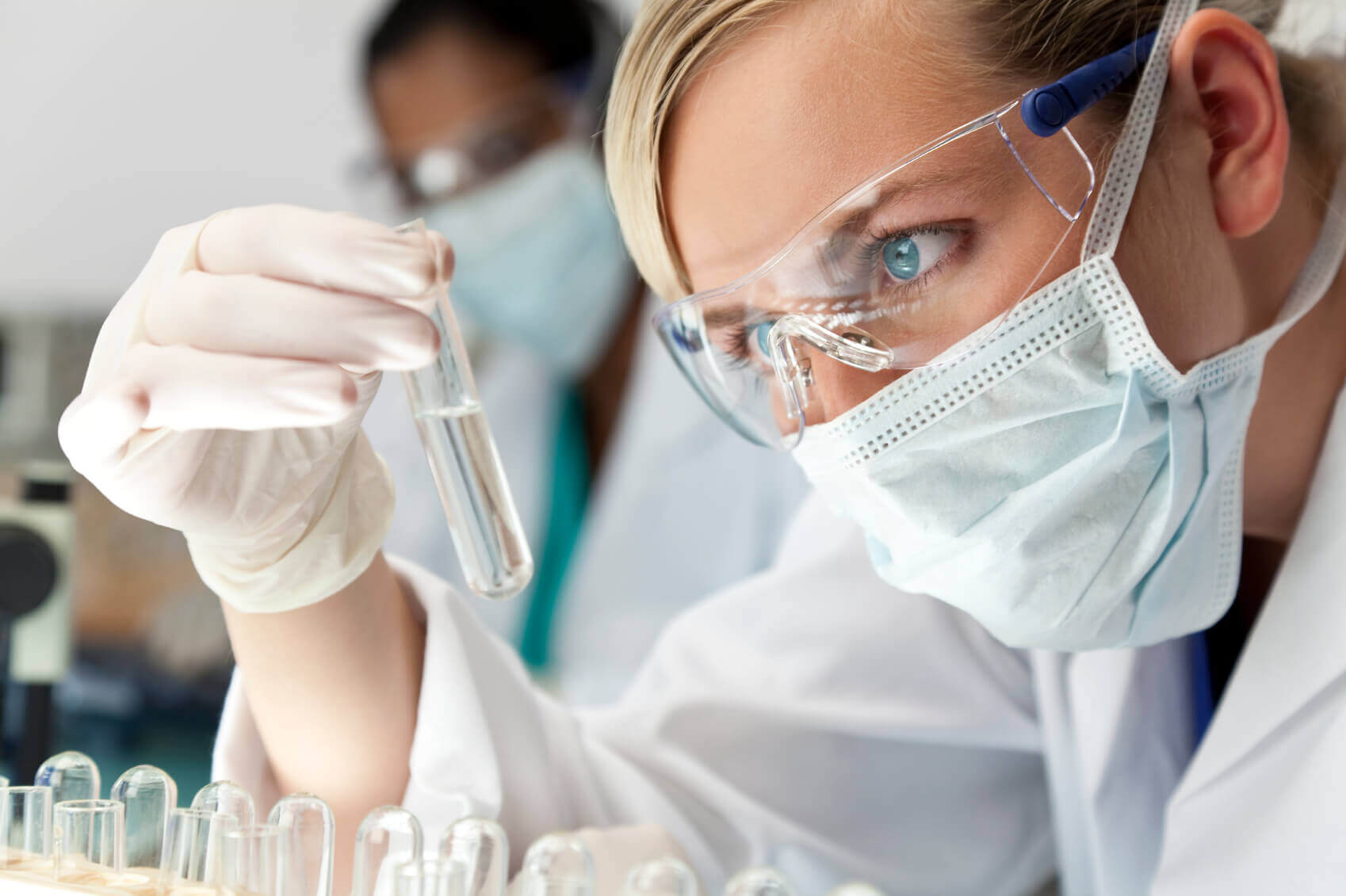 Medical researcher looking at a test tube