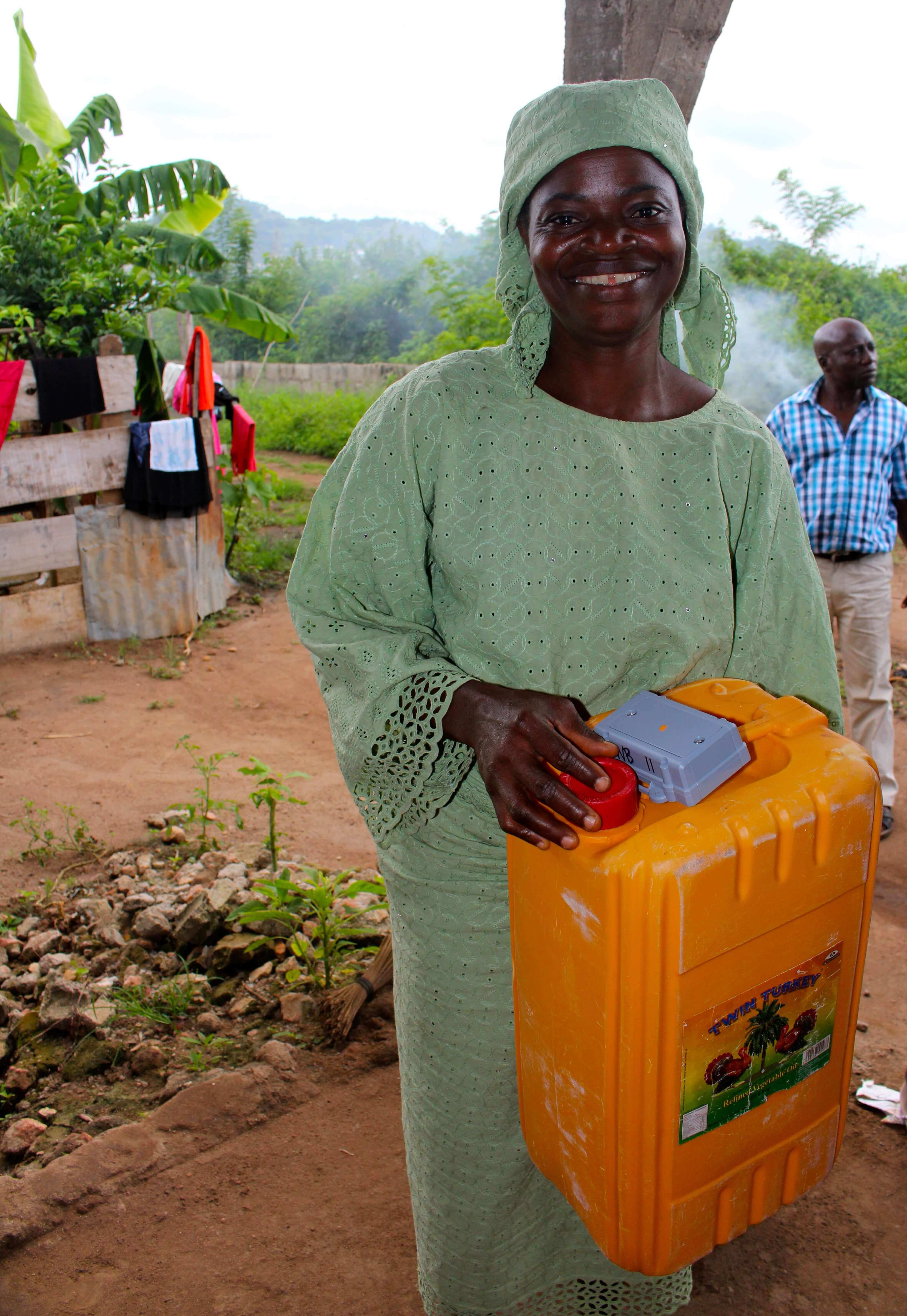 Woman holding a water tank 