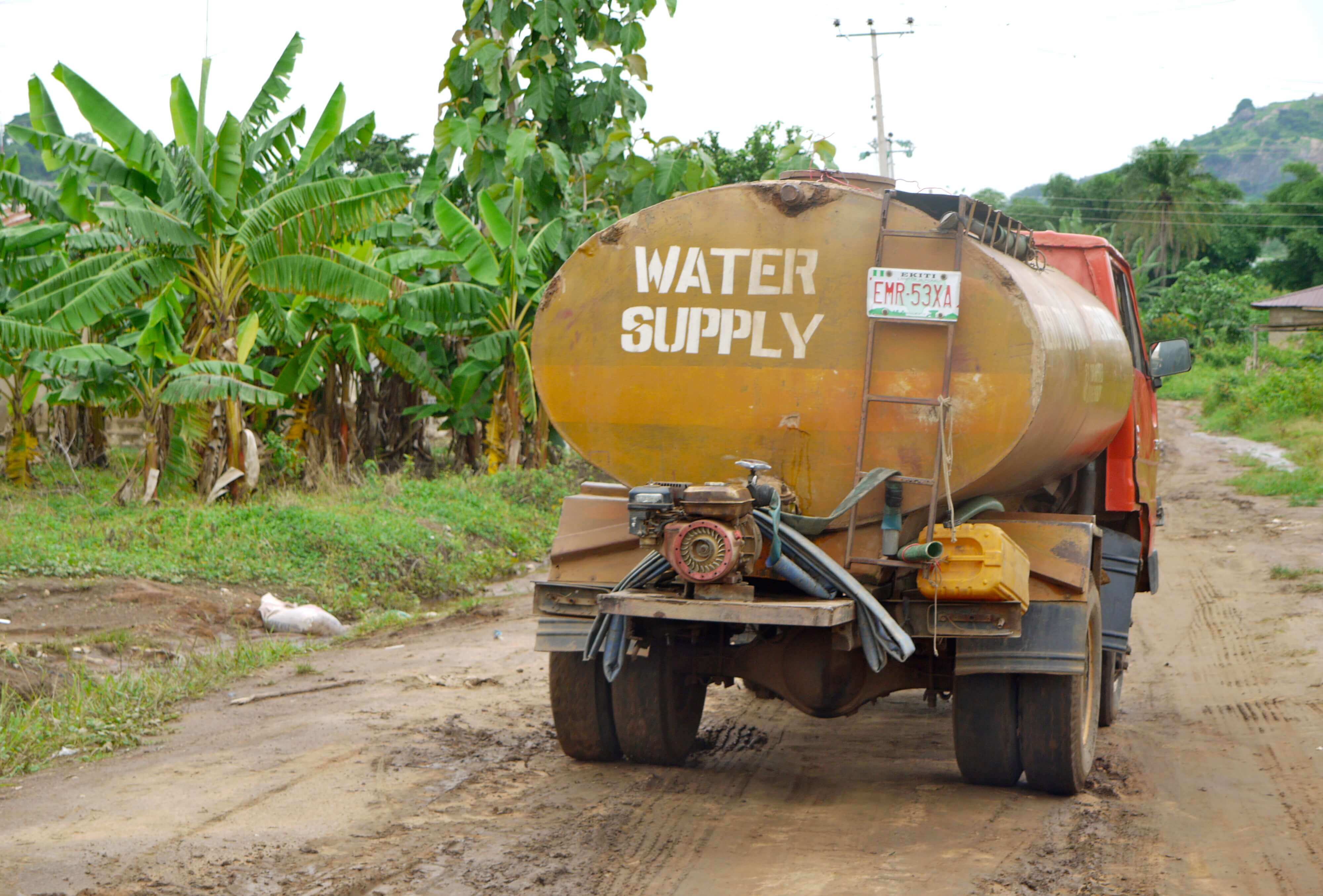 Water supply truck on a jungle road 