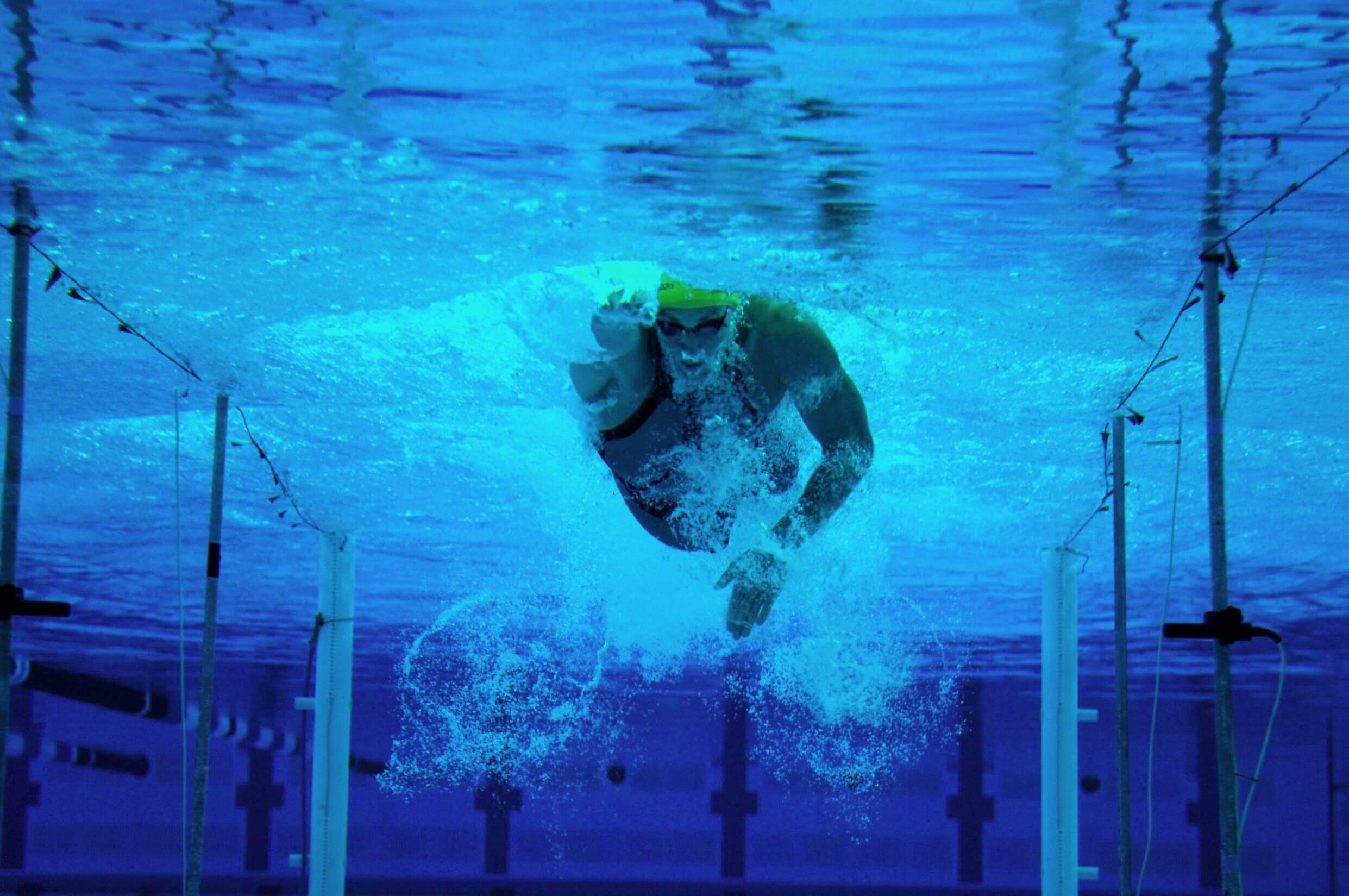 A swimmer seen from underwater 