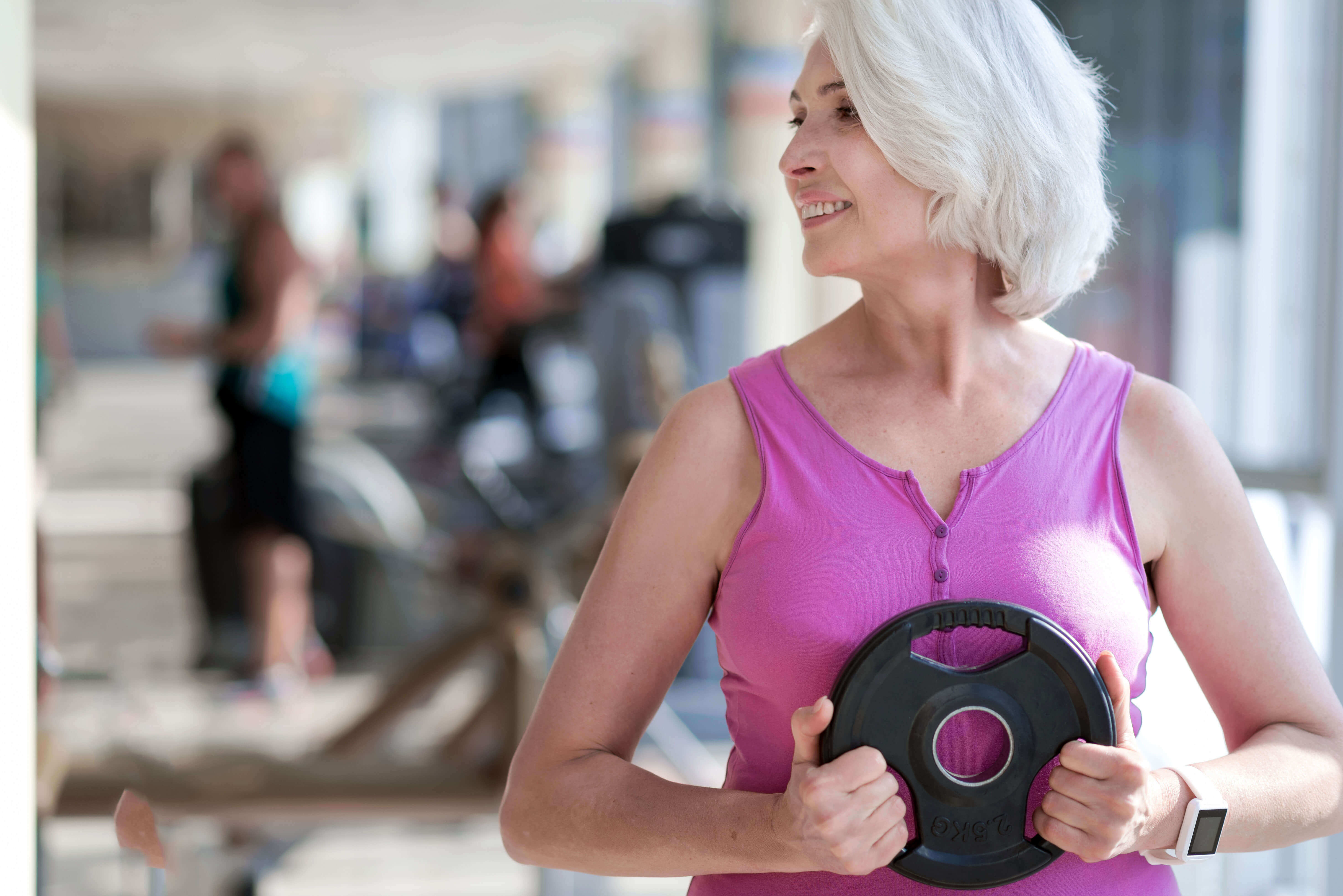 Older woman working out in a gym