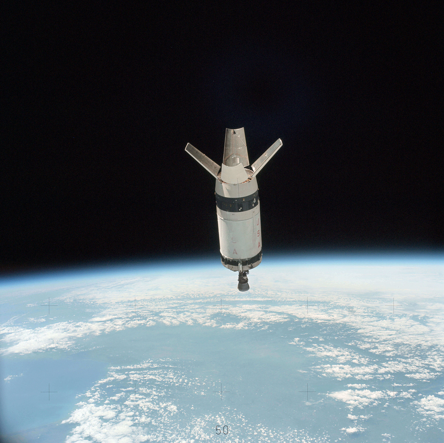 Part of a rocket in space above Earth following stage separation