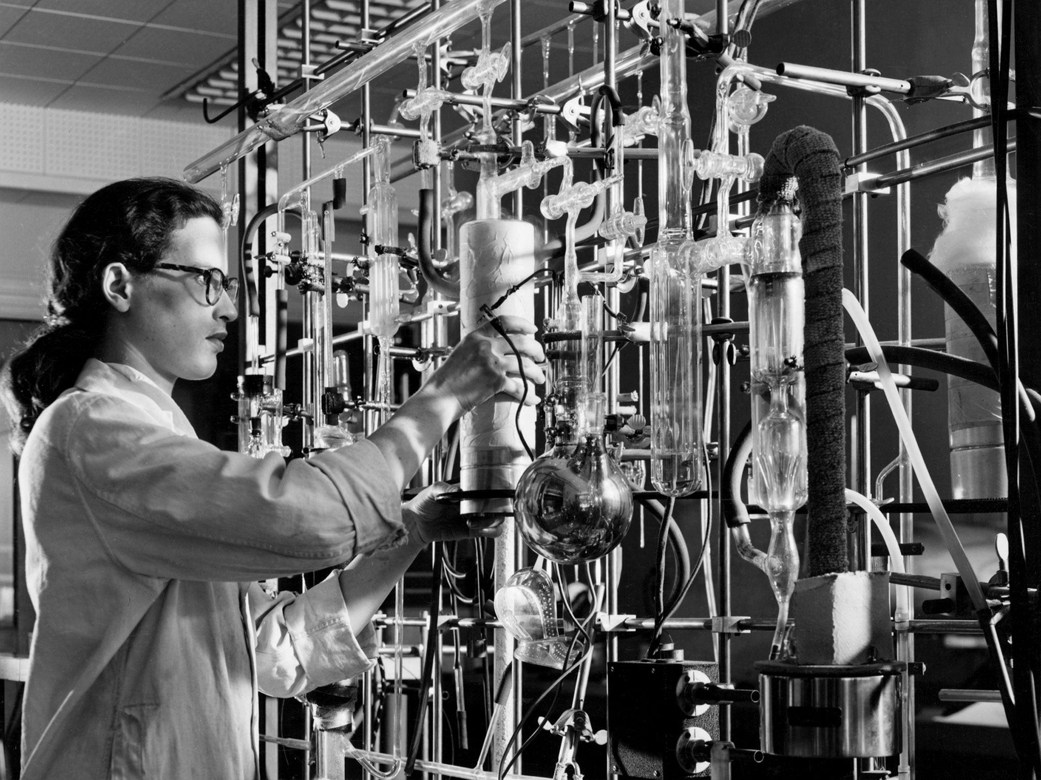 A scientist works with ceramic laboratory equipment 